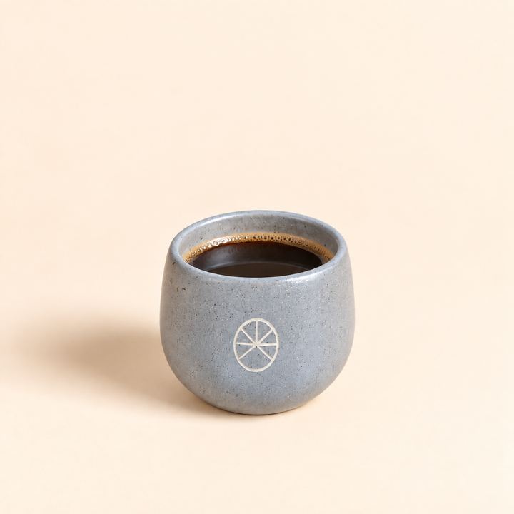 Batch brew coffee in a grey RASA KOPI ceramic cup